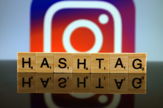"Hashtag" spelt in tiny block letters with the Instagram logo blurry in the background