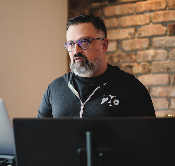 George Arabian analysing client marketing performance and revenue metrics